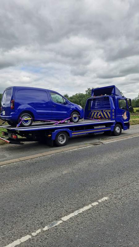 Camel Tow flatbed recovering a blue van — watch more jobs on TikTok